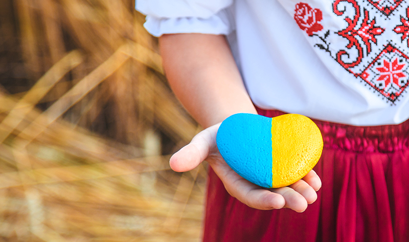 Child in a wheat field. In vyshyvanka, the concept of the Independence Day of Ukraine. Selective focus.